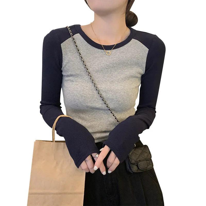 Women's black viscose top with princess sleeves and embroidery detail on oversized slimming design