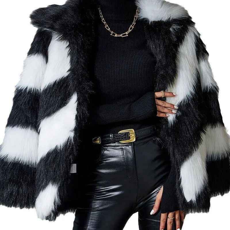Faux fur coat with contrasting colour lapel and a attached fur collar.