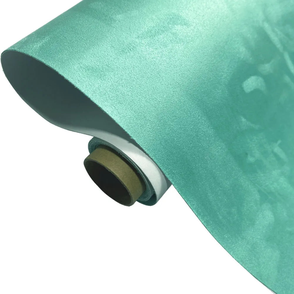 Self-adhesive leather suede sheet roll in multiple colour swatches showing black, brown, blue, and red.