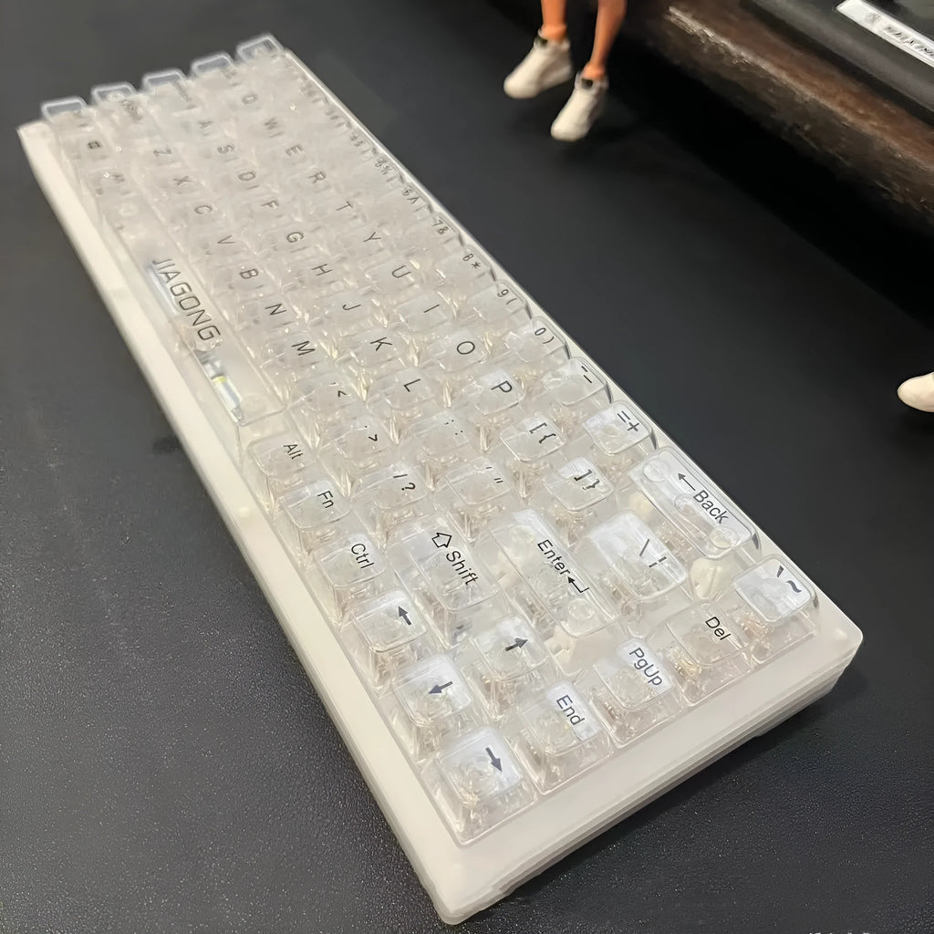132 transparent plastic keyboard key caps arranged in complete set for universal keyboard replacement