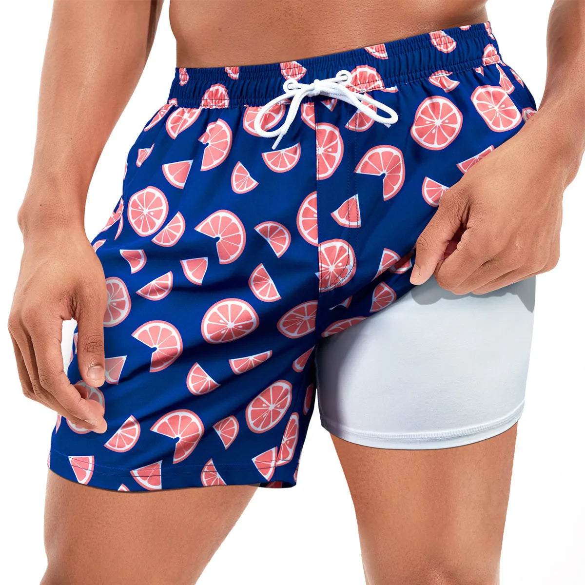 Men's loose swimming trunks with elastic waistband in multiple colour patterns including floral and aquatic designs
