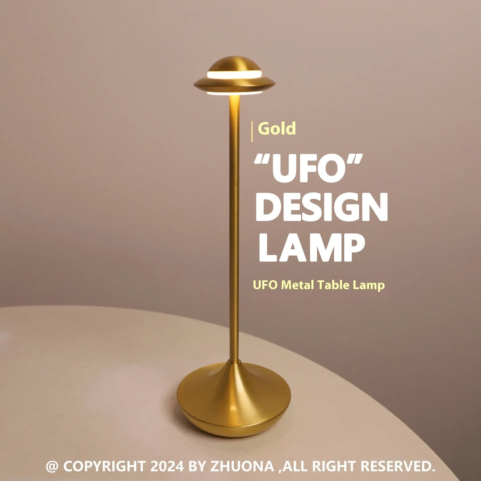 Gold UFO-shaped metal table lamp with touch dimming controls on a desk.