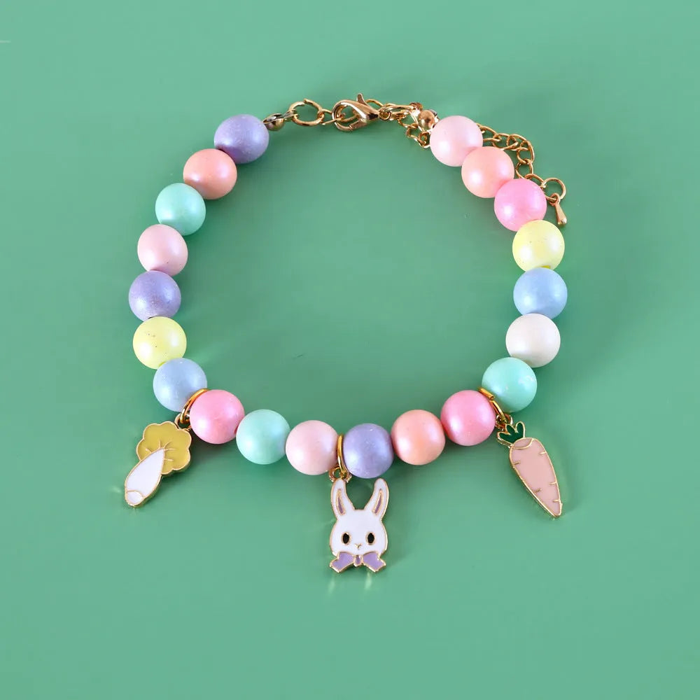 Colourful resin pet jewellery with moon and meteor motifs in macaron colours for dogs and cats