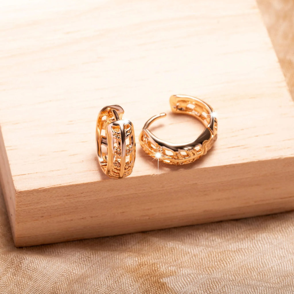 Copper rose gold hollowed-out leaf earrings with heart-shaped details