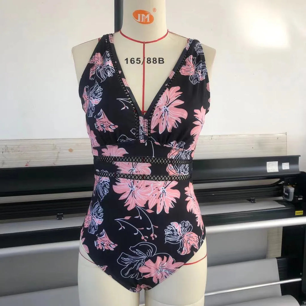 Black print plus size women's bikini swimsuit made from polyester mesh fabric, showing sleeveless design.