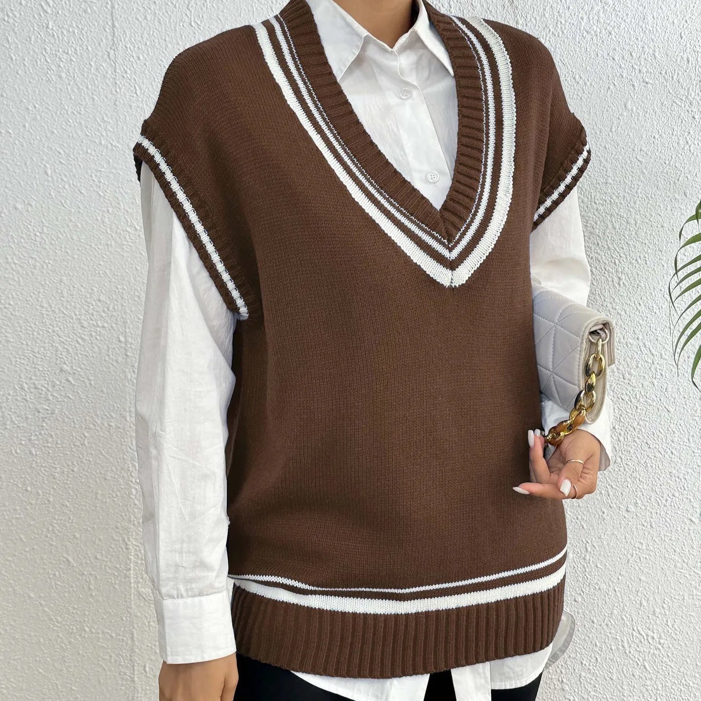 Women's college style casual vest sweater in loose fit with acrylic polyester blend fabric
