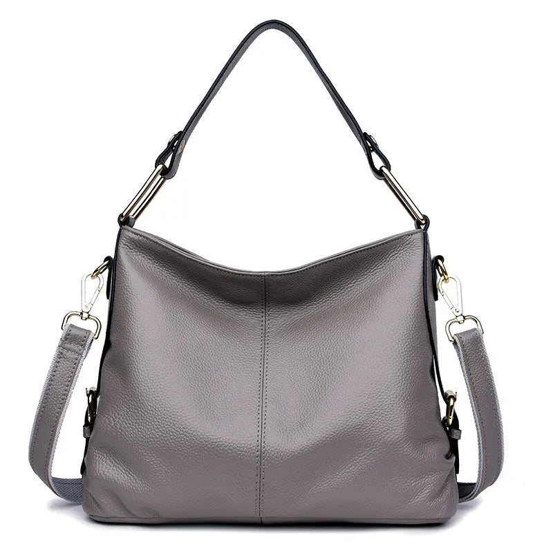 Genuine leather vertical square crossbody bag showing internal phone and document pockets