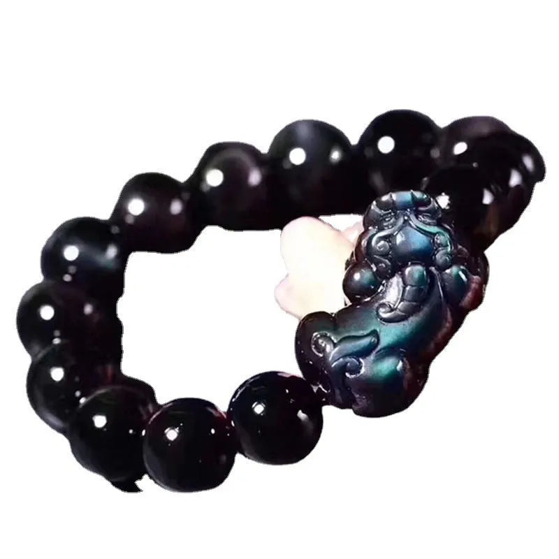 Natural ice colour obsidian crystal bracelet showing pale stone beads on wrist