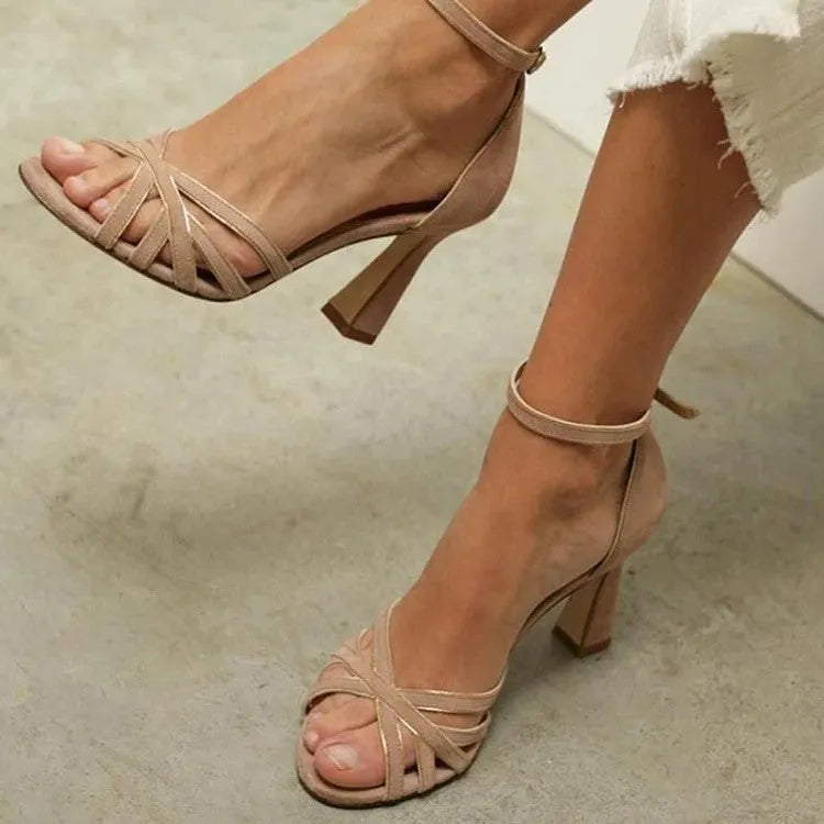Apricot coloured women's suede high heel sandals with a peep toe design and bag heel.