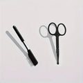 Black ambidextrous pet grooming brush with soft bristles for tear stain removal on dogs and cats