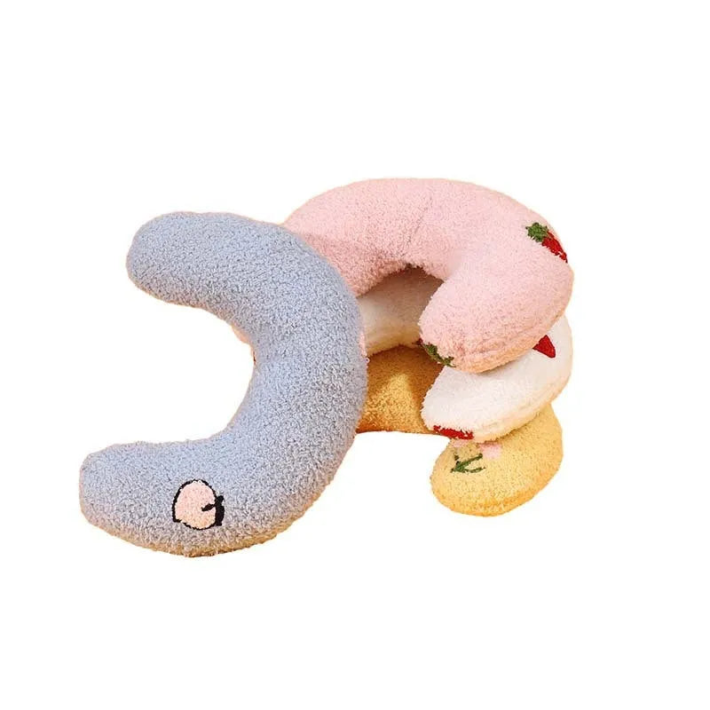 Half moon U-shaped cat pillow with cartoon dog and cat print in blue, pink, white, or yellow.