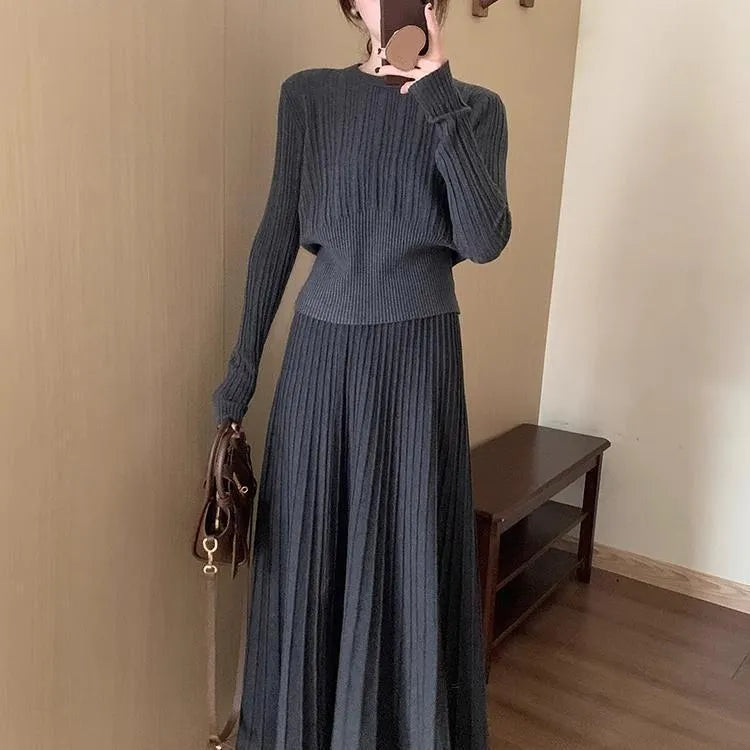 Dark grey knitted long dress suit with artistic retro 3D pattern, showing sweater and skirt.