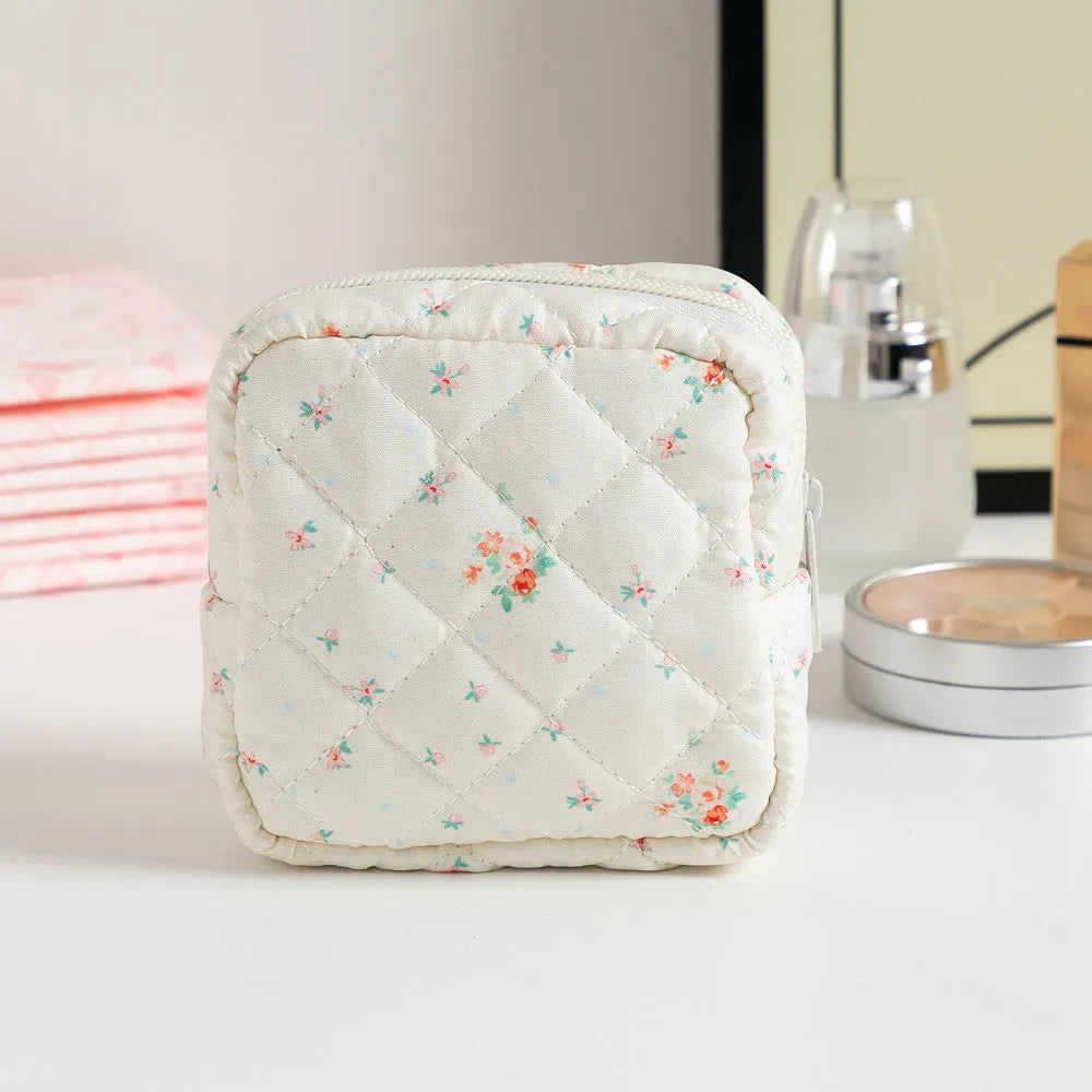 Floral polyester key storage bag with sewing thread detailing in multiple colour patterns