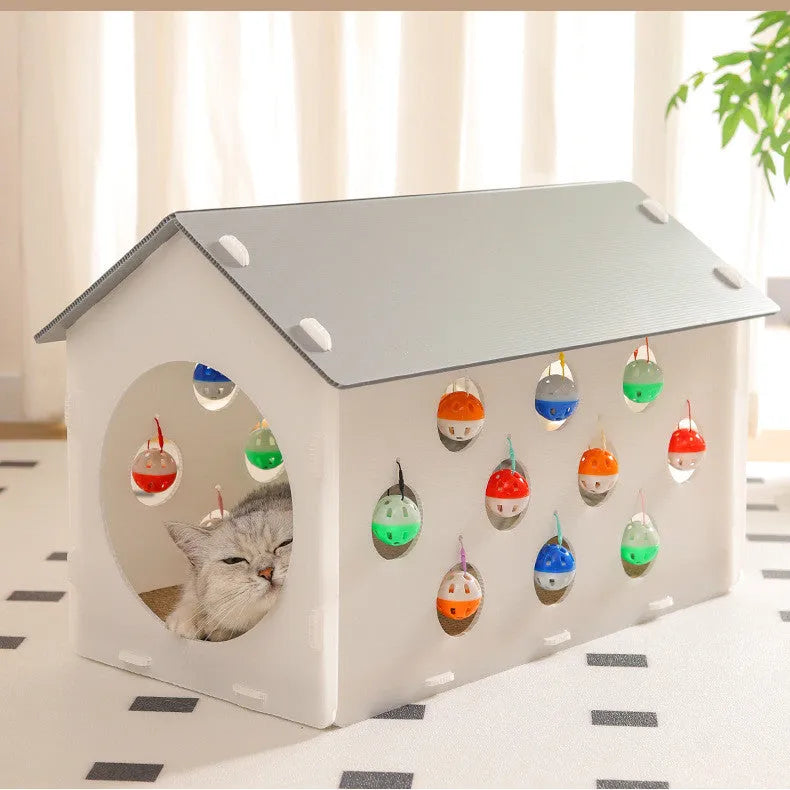 Plastic cat scratch board toy with integrated raised cat nest, tunnel, and bell ball.