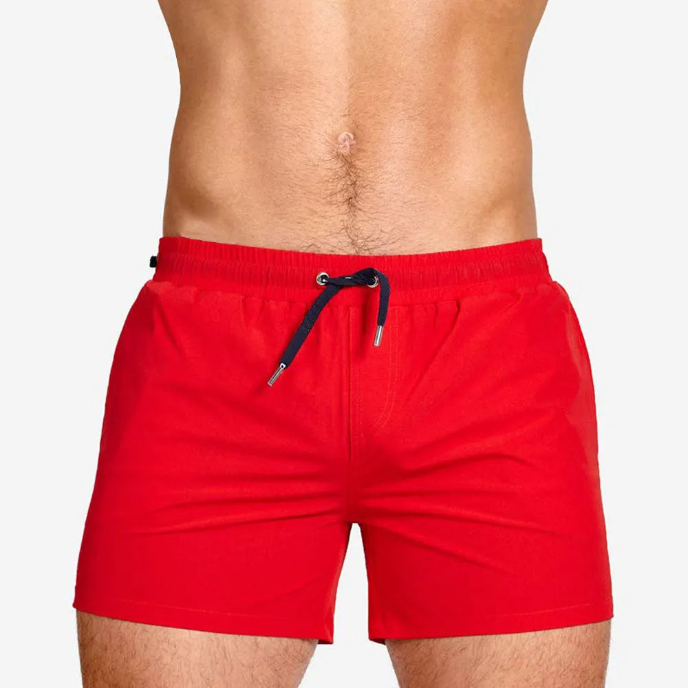Polyester sports shorts with mesh lining in Army Green colour on a white background.