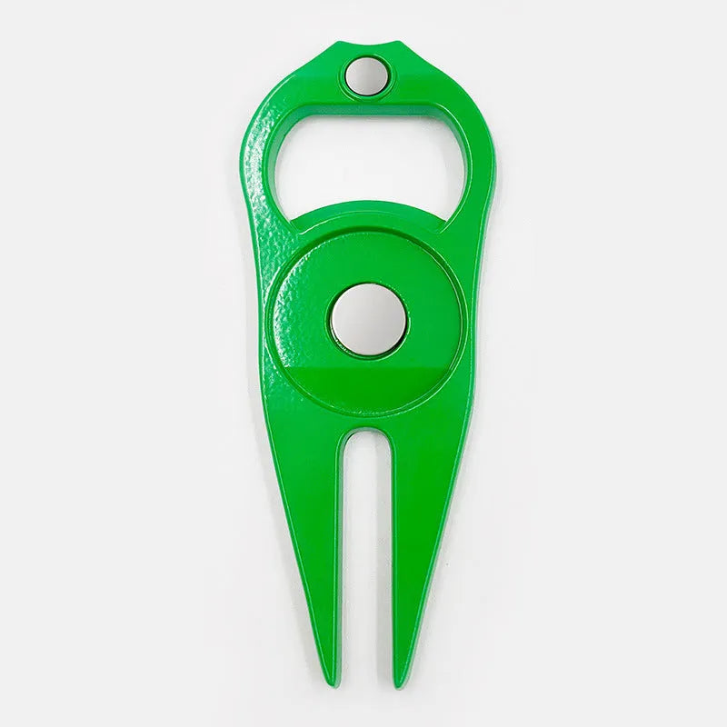Zinc alloy golf ball yoke and bottle opener tool in black or green on a putting green.