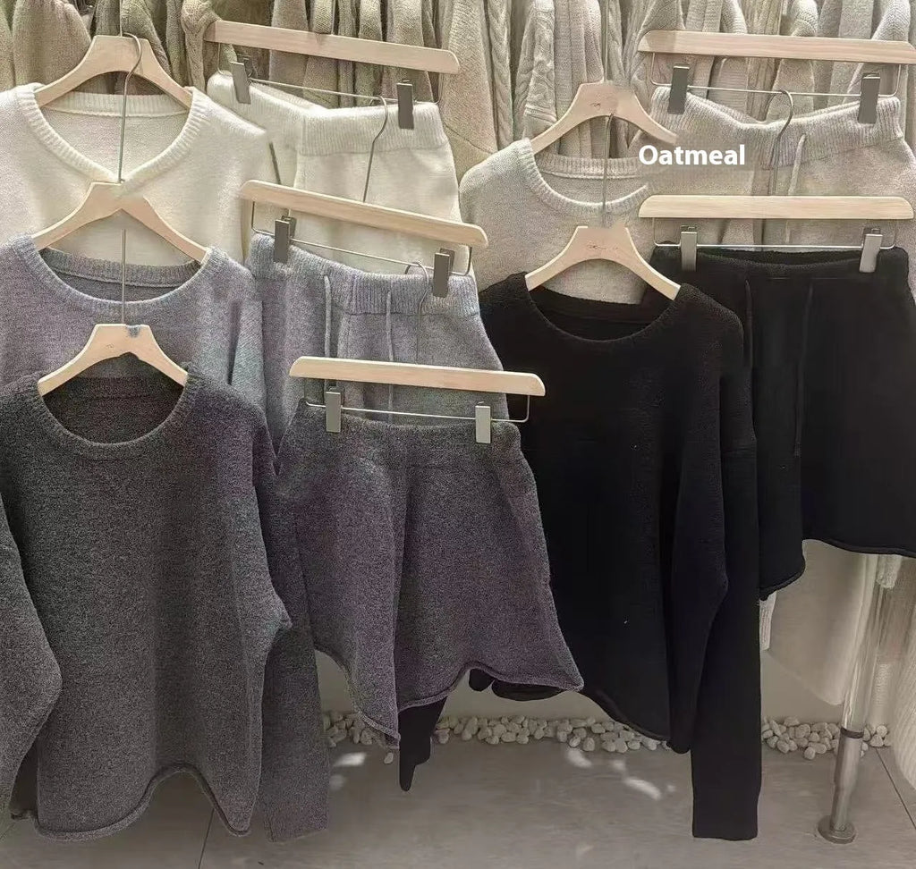 Women's knitted two-piece set showing long sleeve sweater with wide leg shorts in oatmeal colour