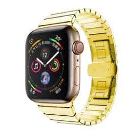 Silver metal Apple Watch strap with butterfly buckle on a wrist, showing the clasp closed.