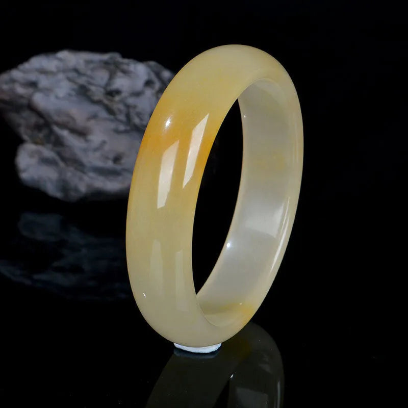 Natural light jade bracelet with Chinese styling in polished gemstone finish showing adjustable sizing from 54mm to 62mm