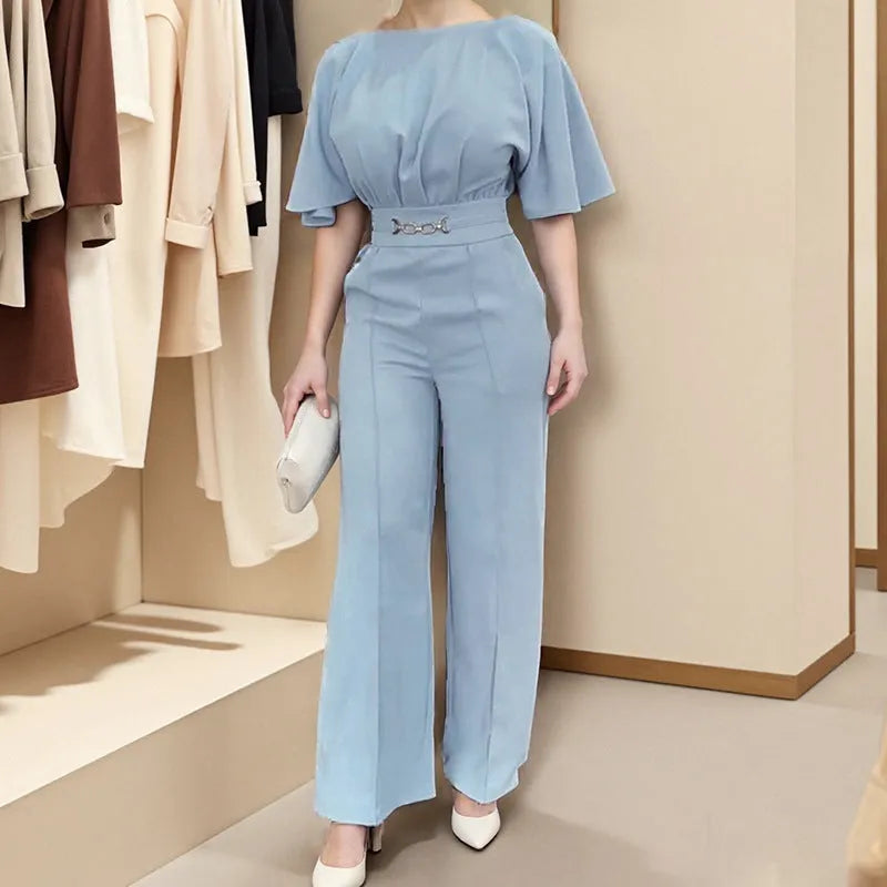 Blue polyester men's suit with long sleeve jacket and trousers on a hanger