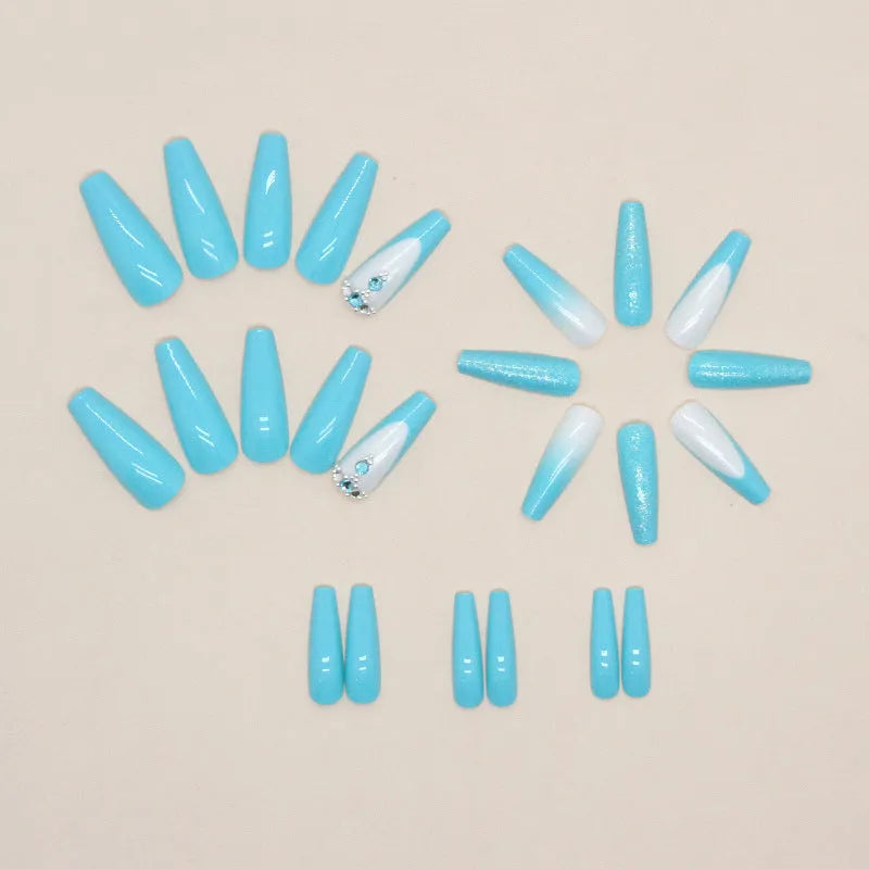Long ballet nail art patches in smart blue diamond colour with scattered diamond debris detailing