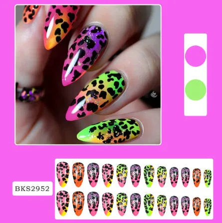 Four boxes of almond shaped nail stickers showing French colourful leaves, colourful plating, star flash macarons, and gradient leopard print designs