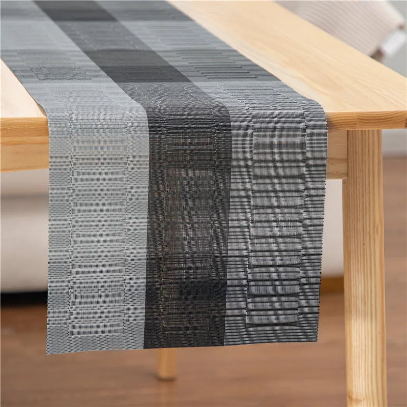 Modern PVC kitchen sink mat in a gradient bamboo colour on a countertop, showing its non-slip texture and size.