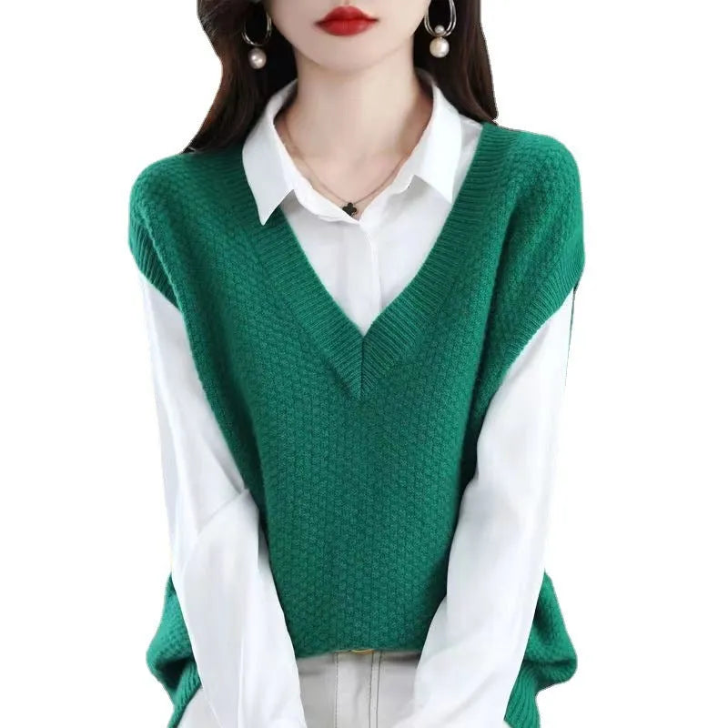 Creamy-white V-neck sleeveless knitted vest with a raised 3D pattern texture.