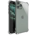 Clear transparent TPU shockproof phone case for multiple iPhone models on a table.