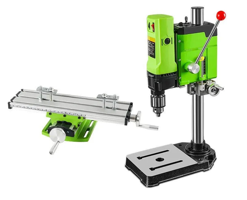 Mini bench drill milling machine with cross bench pliers on workbench