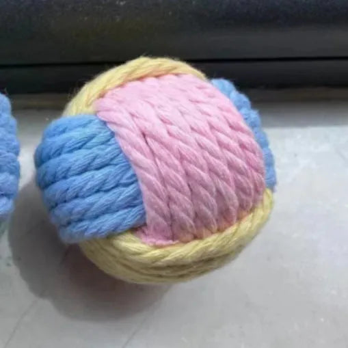 Handmade blue powder and green cat hair ball plush cotton toy for pet teeth grinding.