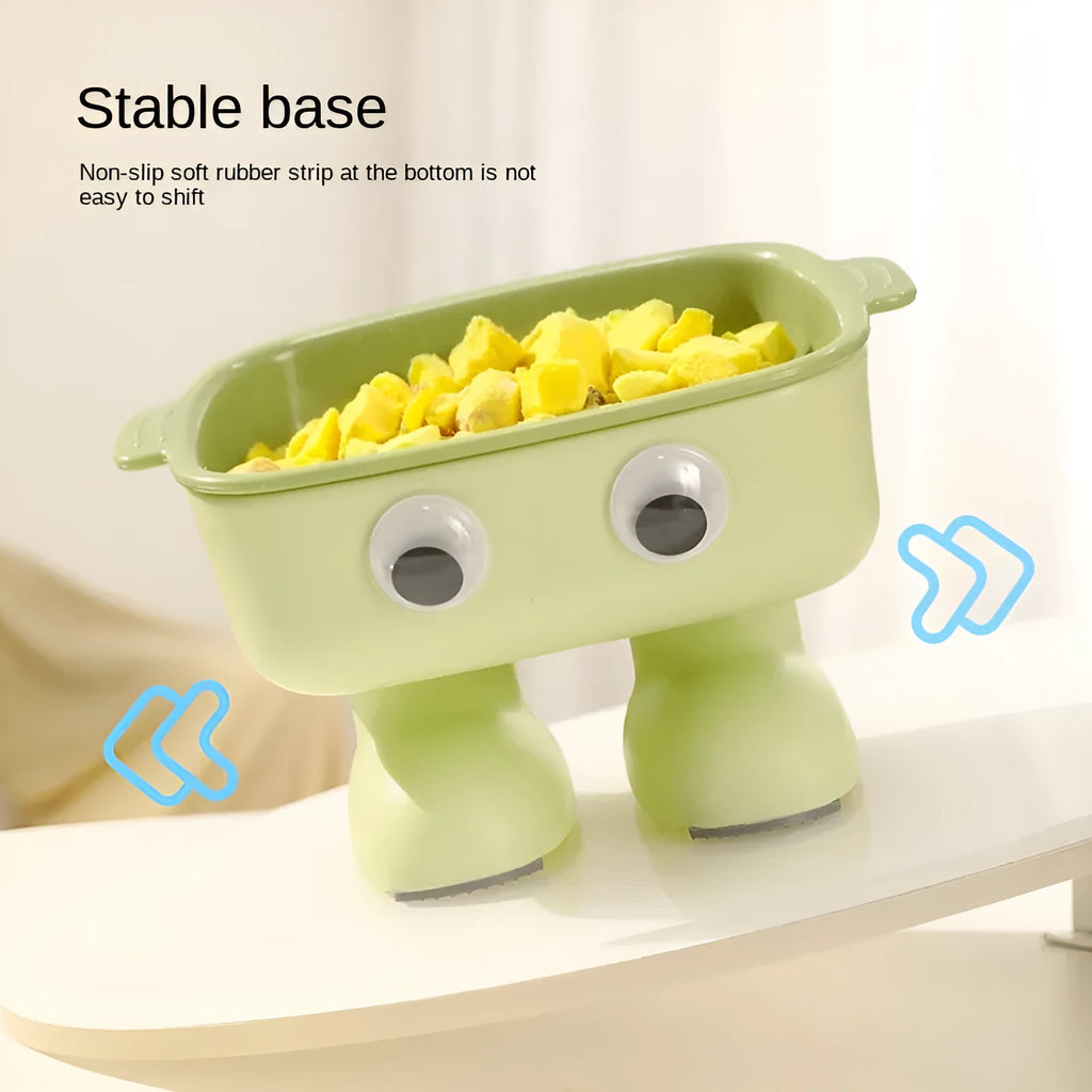 Green robot-shaped elevated cat bowl with tilted dish and anti-slip base.