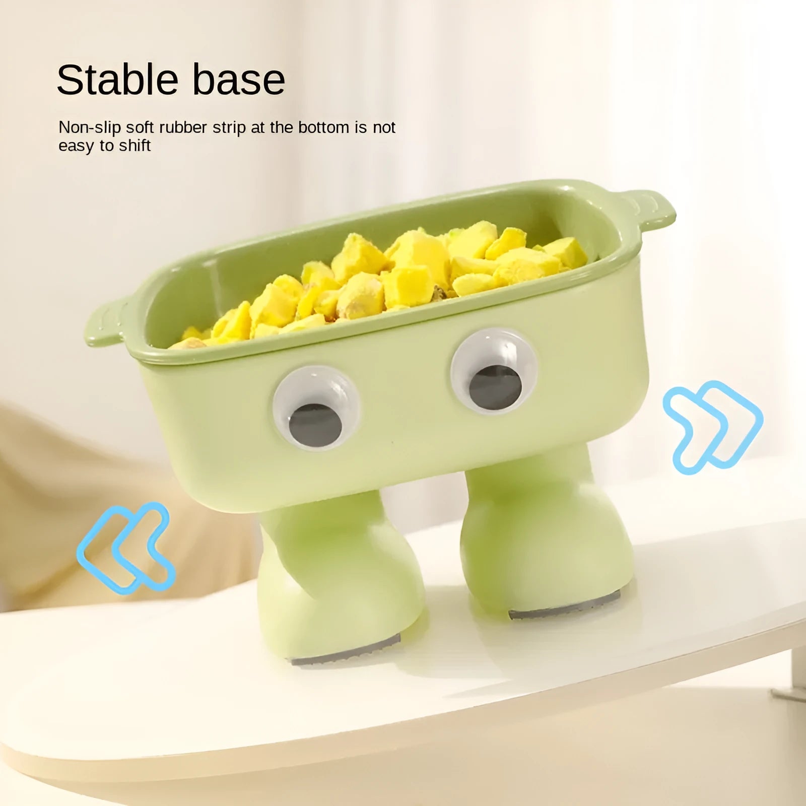 Green robot-shaped elevated cat bowl with tilted dish and anti-slip base.