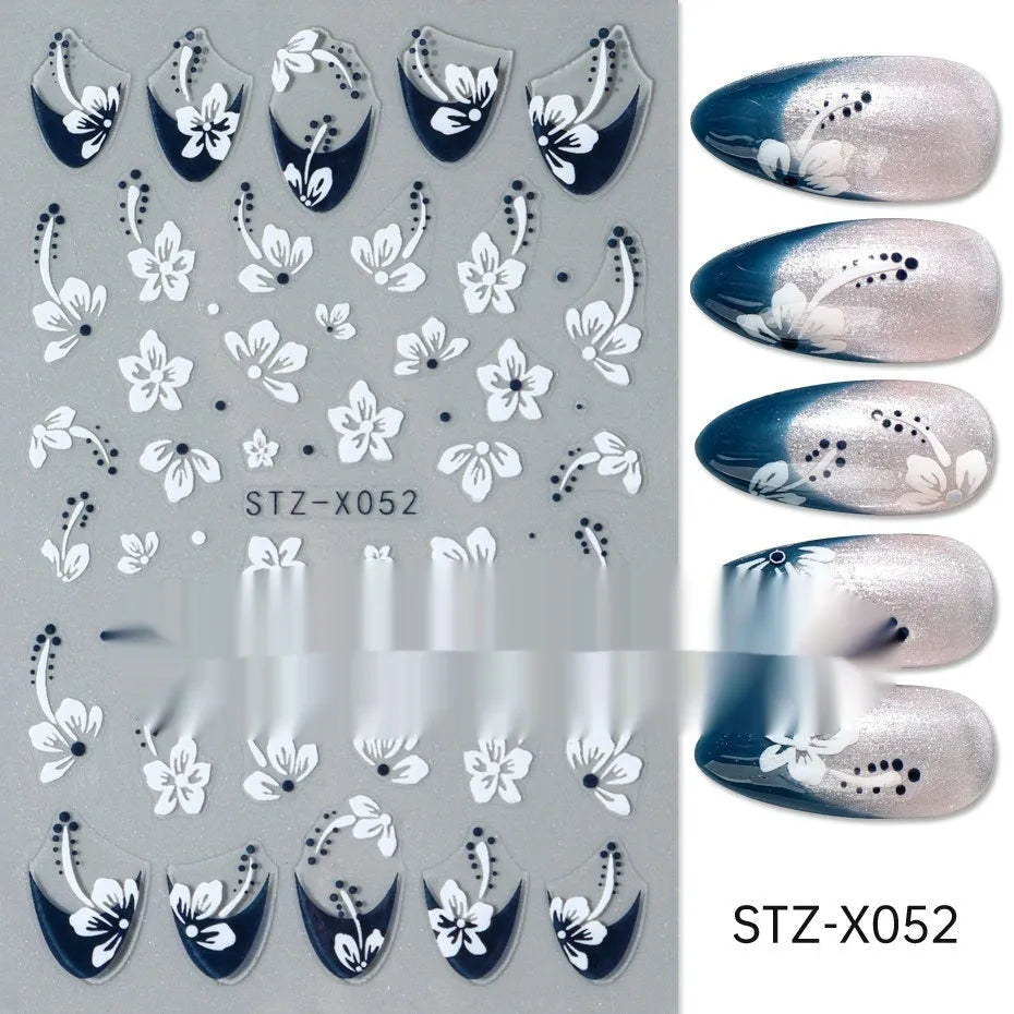 Plastic sheet of black, silver, and cartoon design nail art stickers for DIY manicures.