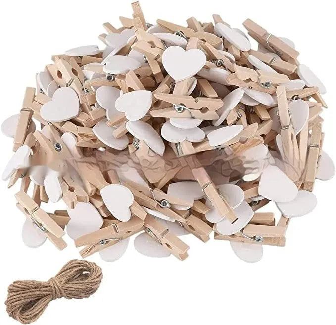 Five solid wood heart-shaped clips in different colours showing handmade construction details