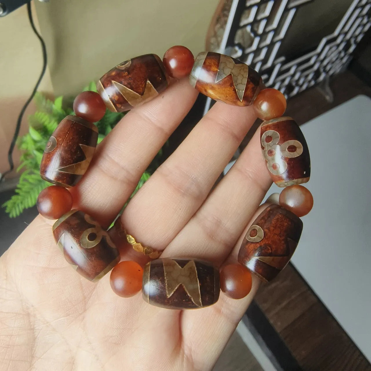 Agate Tibetan dzi bead bracelet with three-eye design and polished finish