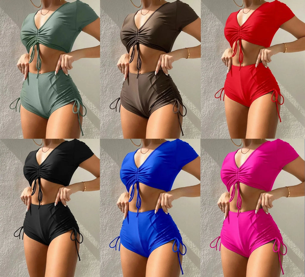Women's two-piece swimsuit with lace-up front and bow detail in dark green.