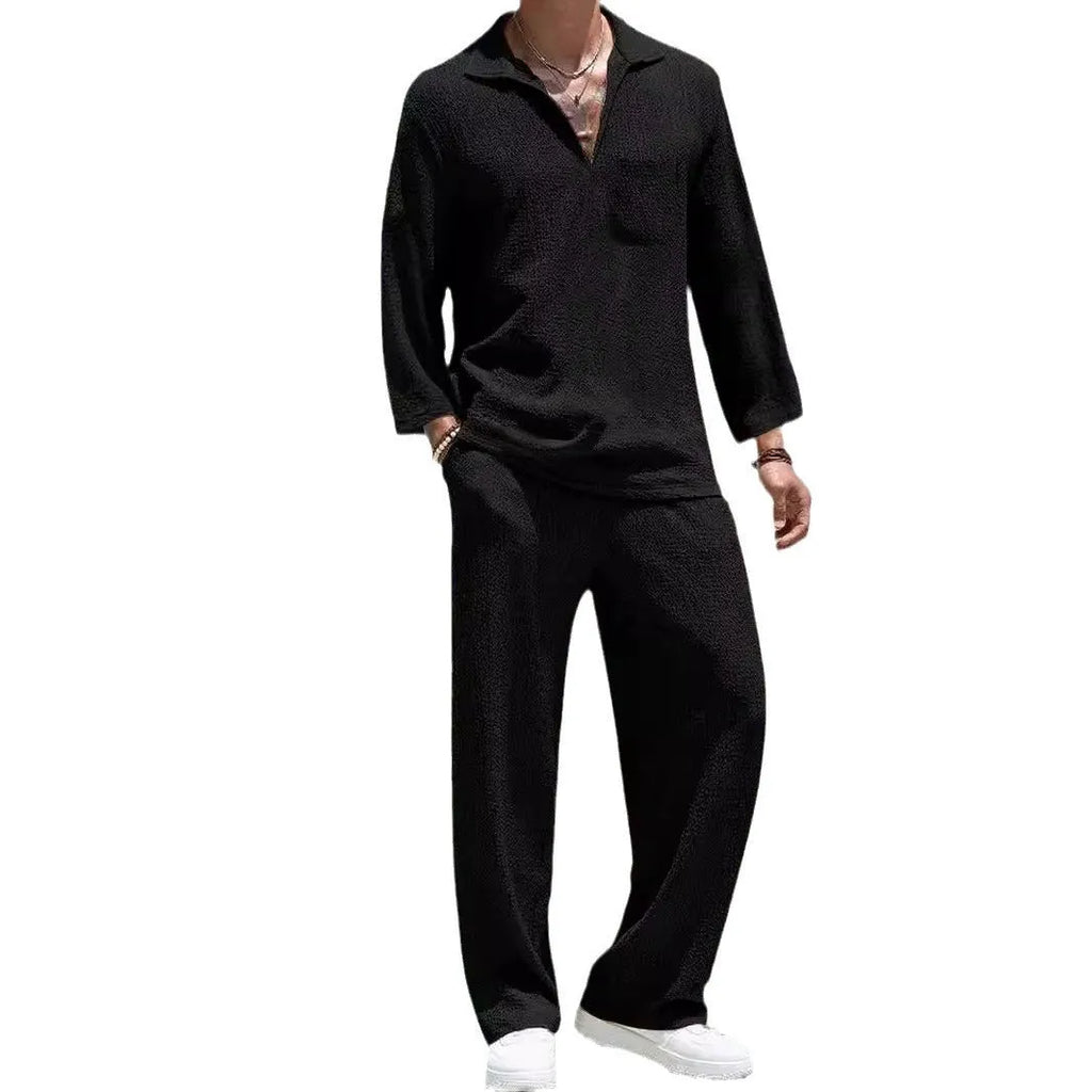 Man wearing a lake blue casual shirt and matching trousers from a polyester suit set.