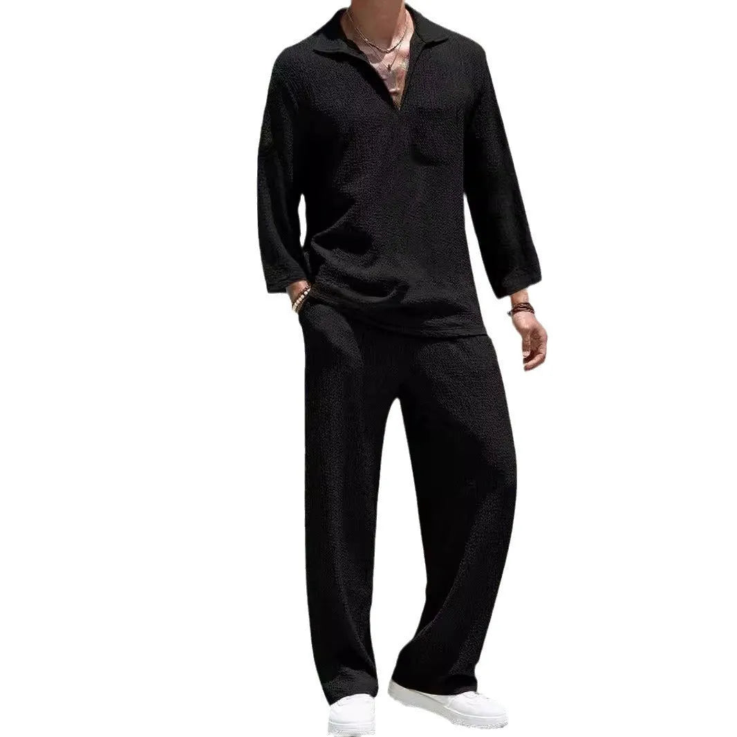 Man wearing a lake blue casual shirt and matching trousers from a polyester suit set.