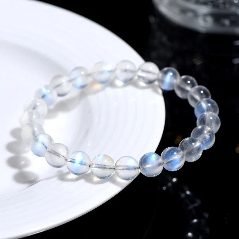 Natural cream crystal bracelet with blue moonlight design and polished beads