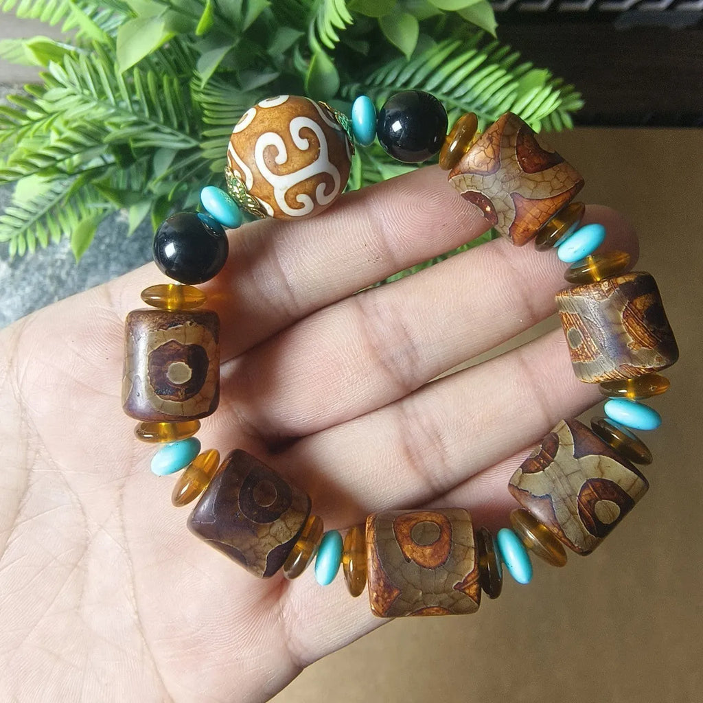 Agate Tibetan dzi bead bracelet with three-eye design and polished finish