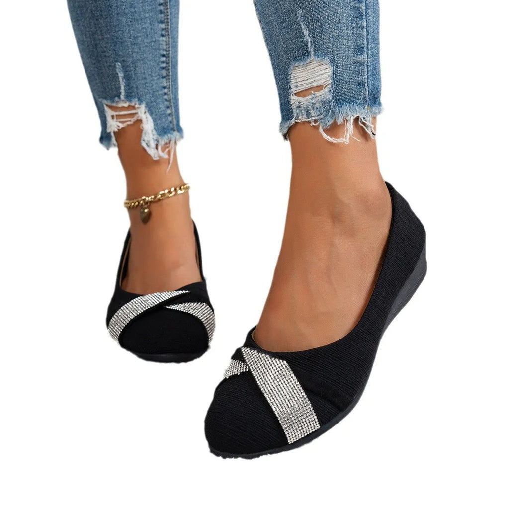 Black women's low-cut slip-on casual shoes with rhinestone decoration and a chunky short heel.