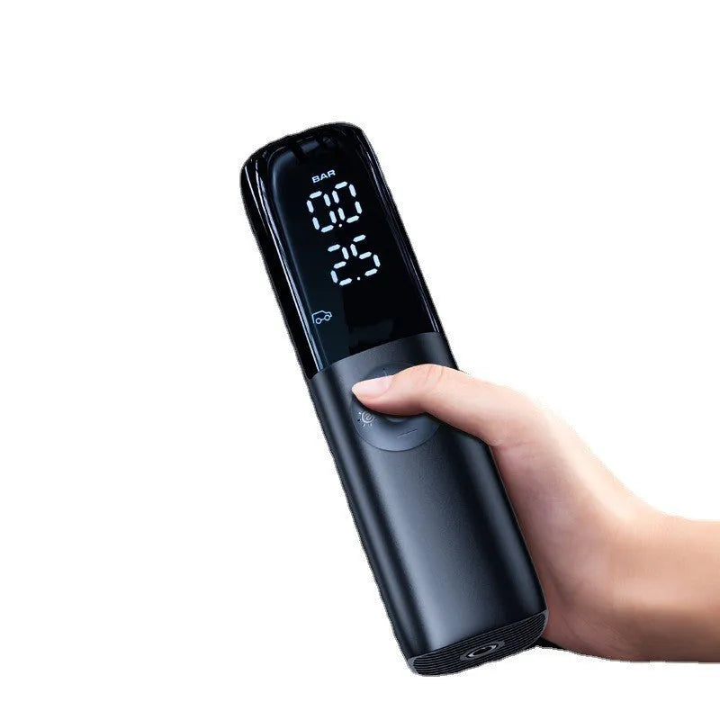 Black portable electric car air pump with plug-in connection and pressure gauge