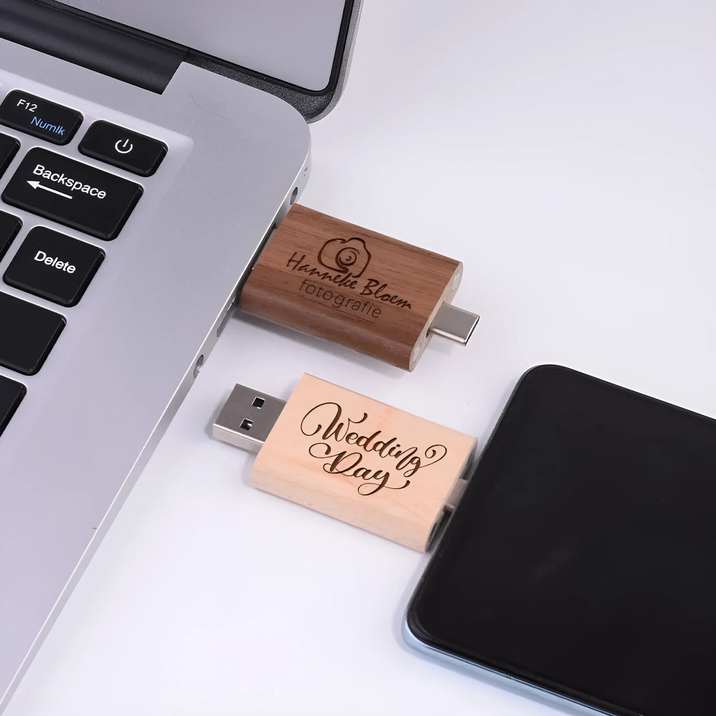 Custom engraved maple wood USB flash drive with Type-C connector for mobile phones on a wooden box.