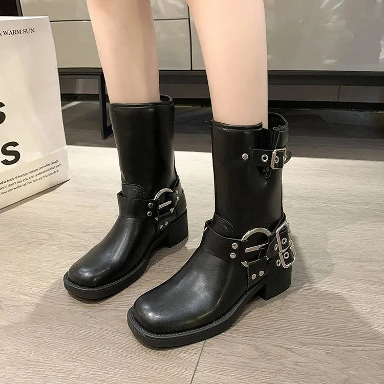 Women's black platform boots with mid-calf sock design and ankle buckle strap