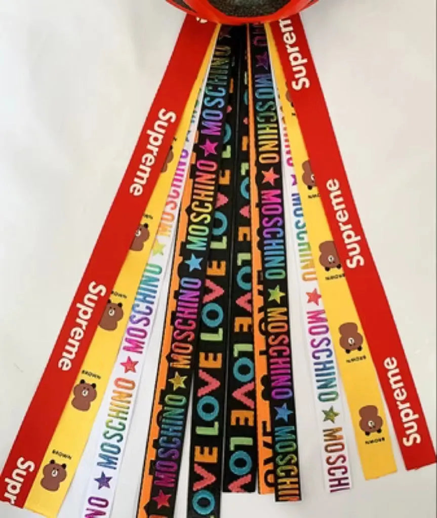 Close-up of a colourful decorative ribbon streamer attached to a child's helmet for roller skating or skiing.