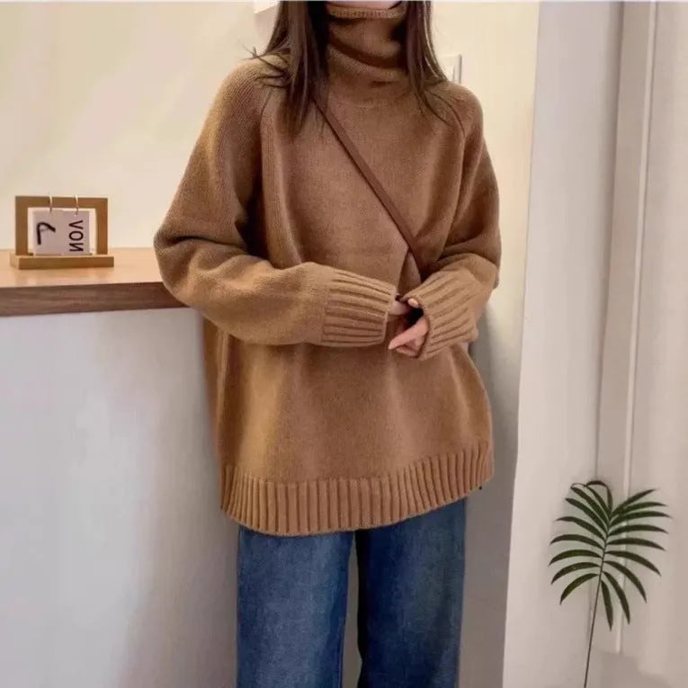 Red loose-fit women's turtleneck sweater with thick knit and a textured curling collar.