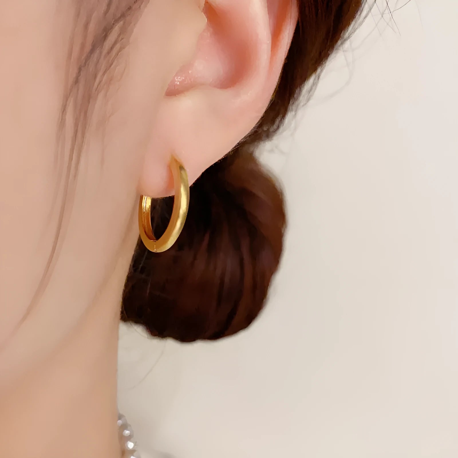 Geometric women's ear clips with gold plating and round eyelet design on copper material