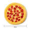 Yellow pizza slice shaped dog chew toy with textured pepperoni and crust details