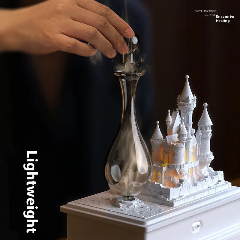 White medieval castle-shaped waterless aromatherapy machine with ambient light as a decorative ornament.